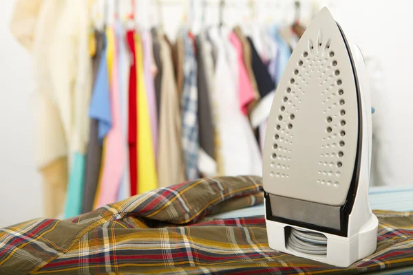 Electric iron and shirt — Stock Photo, Image