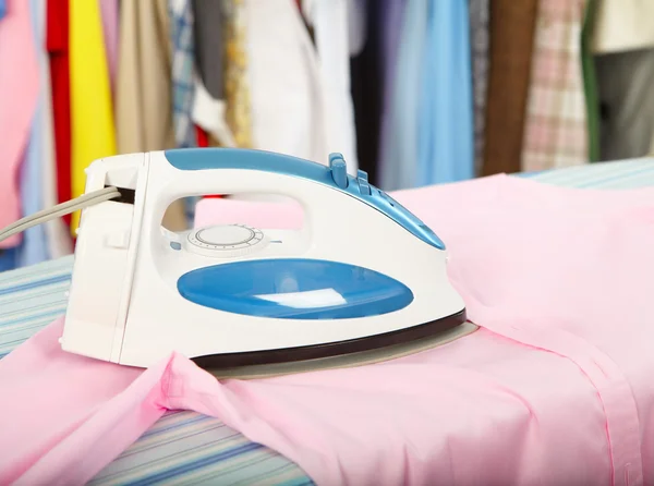 Electric iron and shirt — Stock Photo, Image