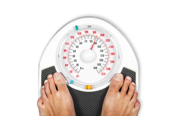 A pair of man's feet standing on a scale — Stock Photo, Image