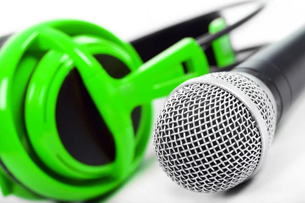 Microphone and green headphones — Stock Photo, Image