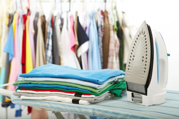 Electric iron and shirt — Stock Photo, Image