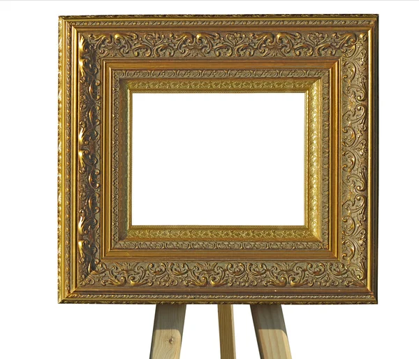 Old vintage golden picture frameon a stand isolated over white — Stock Photo, Image