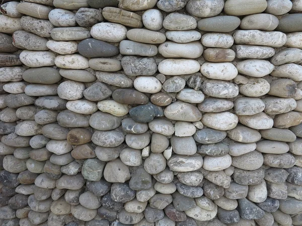 Patroon van decoratieve ronde stenen muur oppervlak — Stockfoto