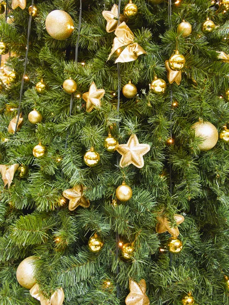 Abstract christmas background with golden balls and stars Royalty Free Stock Images