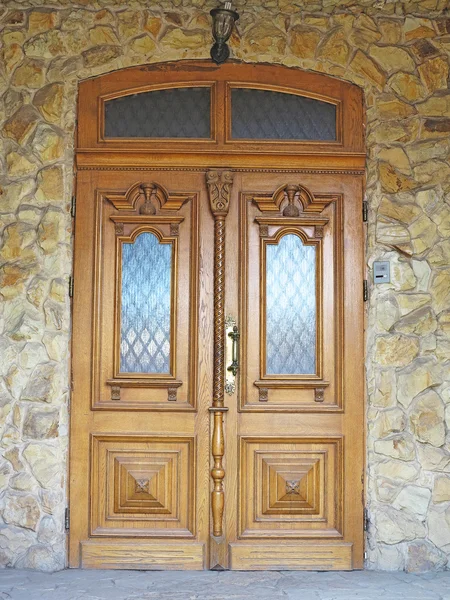 Old brown vintage wooden door with decoration — Stock Photo, Image