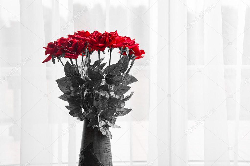 Bouquet of fresh red roses in a vase.