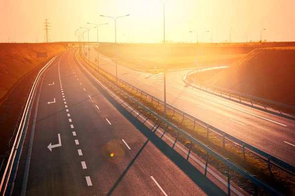 Red sunset over empty highway — Stock Photo, Image