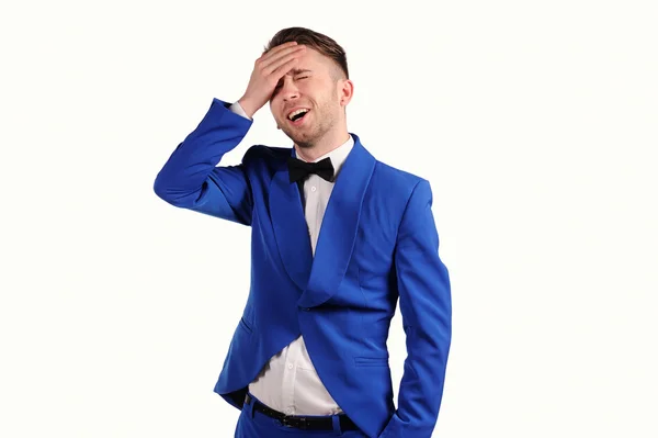 Man in blue suite with incredulous face  on white background — Stock Photo, Image