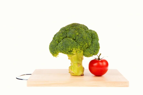 Broccoli with tomato  isolated on white — Stock Photo, Image