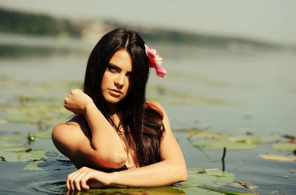 Sexy brunette woman in water. summer season — Stock Photo, Image