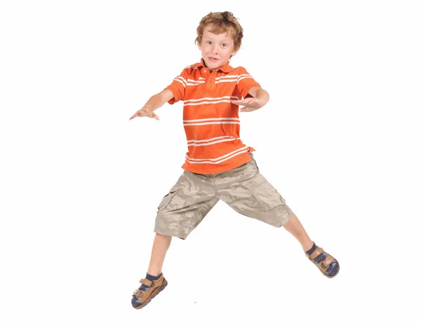 Springender Junge auf weißem Hintergrund — Stockfoto