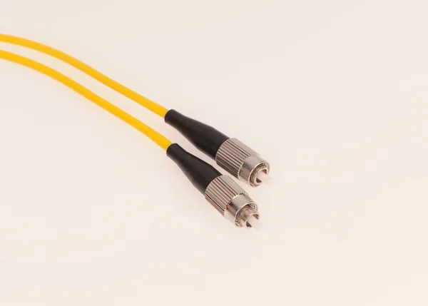 Cables de fibra óptica aislados sobre fondo gris —  Fotos de Stock