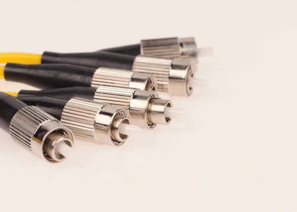 Cables de fibra óptica aislados sobre fondo gris —  Fotos de Stock