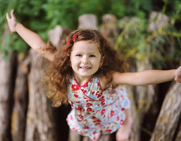 Little pretty girl in the green garden — Stock Photo, Image