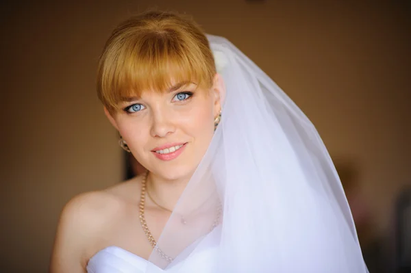 Beautiful bride  indoor near the window — Stock Photo, Image