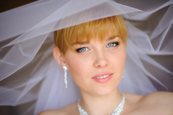 Beautiful bride  indoor near the window — Stock Photo, Image