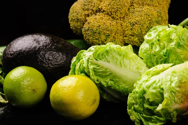 Different vegetables on the black background — Stock Photo, Image