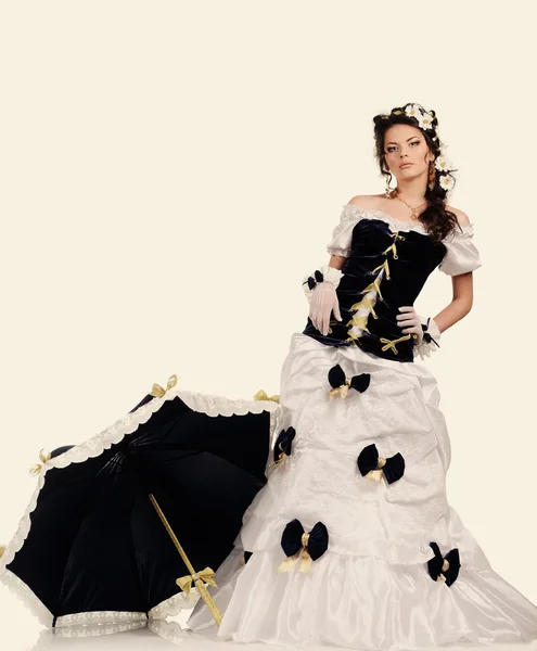 Girl with chamomile in the hair  and umbrella in vintage dress — Stock Photo, Image