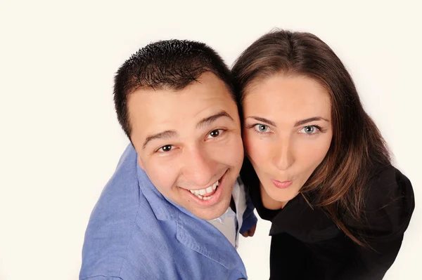 Man och kvinna med roliga ansikten isolerade över vit bakgrund — Stockfoto
