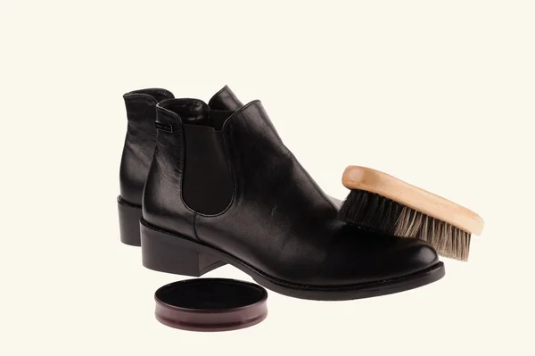 Black boots with shoe brush — Stock Photo, Image