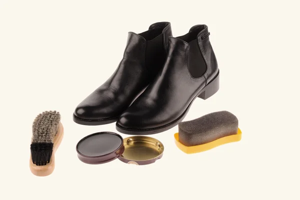 Black boots with shoe brush — Stock Photo, Image