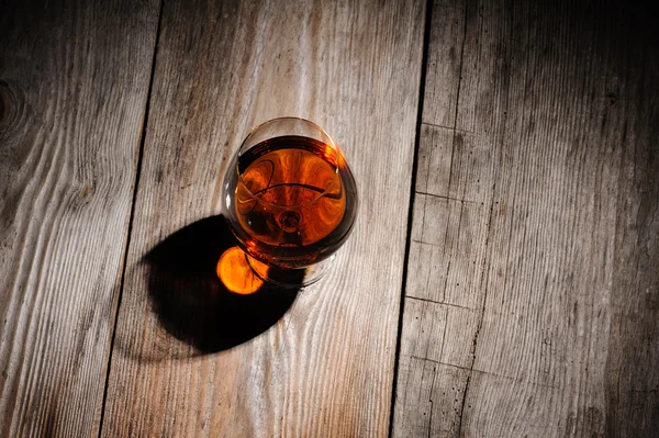 Cognac on the wooden table — Stock Photo, Image