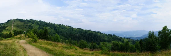 Summer landscape in mountains and the dark blue sky with clouds — Stock Photo, Image