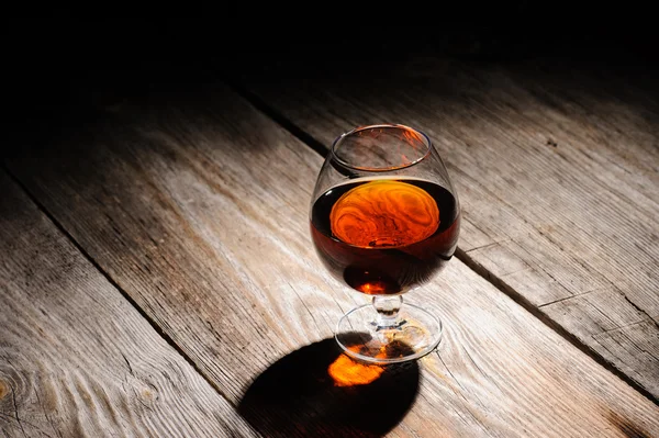 Cognac on the wooden table — Stock Photo, Image