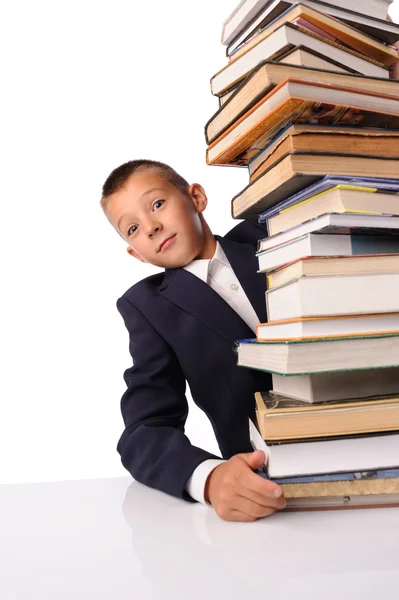Schooljongen met enorme stapel boeken — Stok fotoğraf