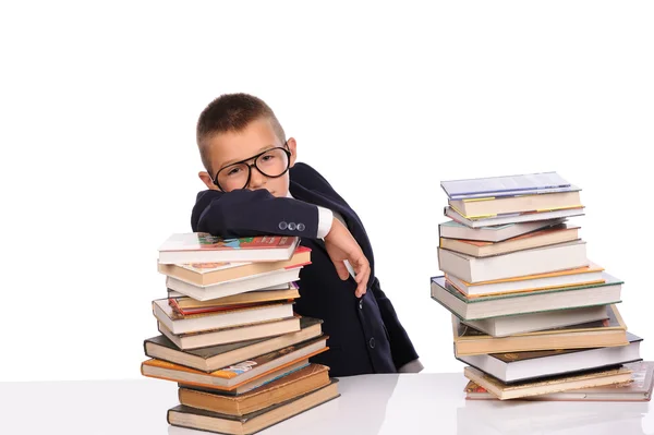 Schooljongen met enorme stapel boeken — Stok fotoğraf