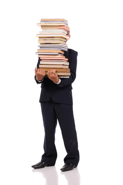 Schoolboy holding huge stack of books — Stock Photo, Image