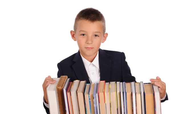 Schoolboy with huge stack of books — Stock Photo, Image