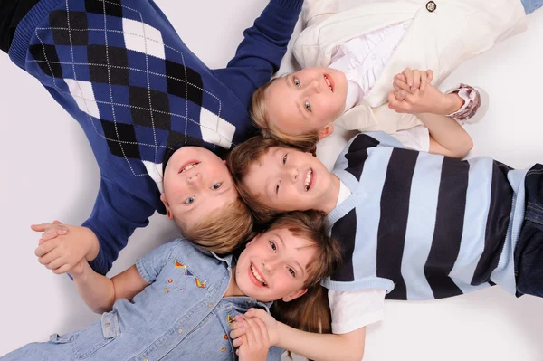 Children lying on the floor — Stock Photo, Image