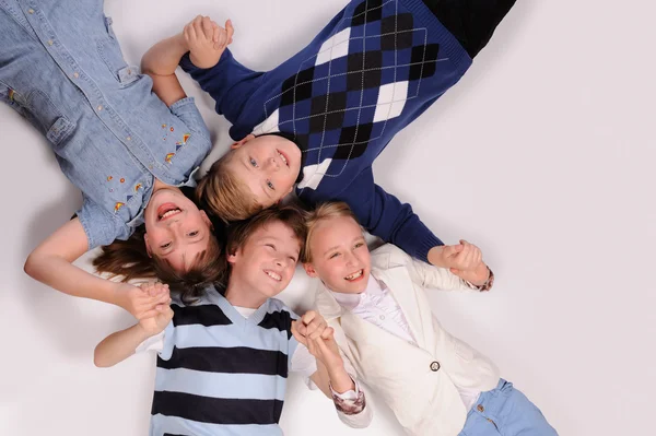 Children lying on the floor — Stock Photo, Image