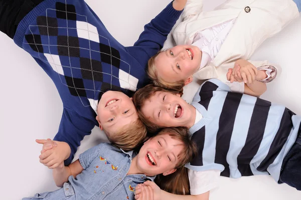 Children lying on the floor — Stock Photo, Image