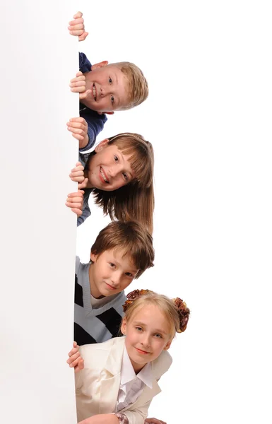 Portrait of happy children with white blank — Stock Photo, Image