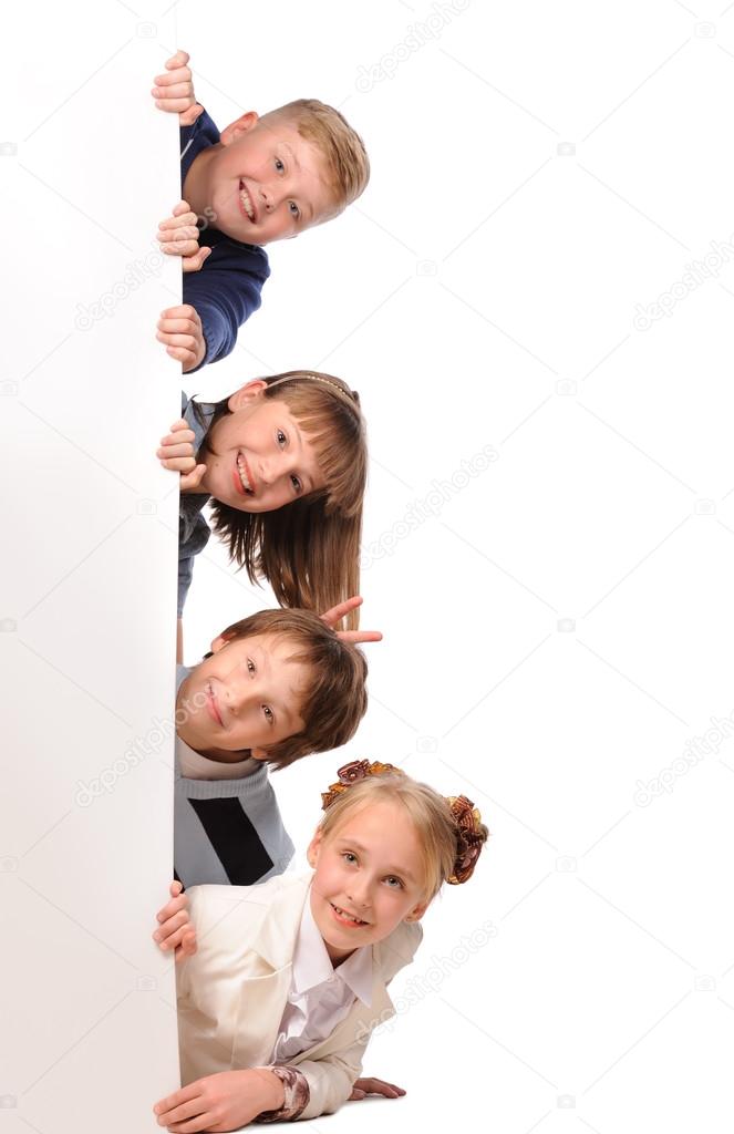 Portrait of happy children with white blank