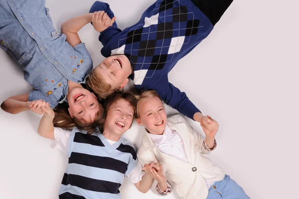 Children lying on the floor — Stock Photo, Image