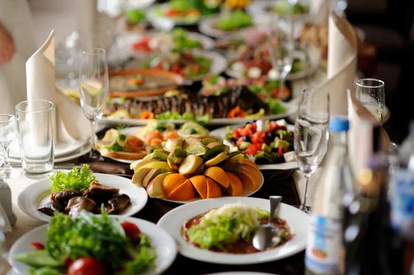 Table set service with silverware and glass stemware at restaurant before party Stock Photo