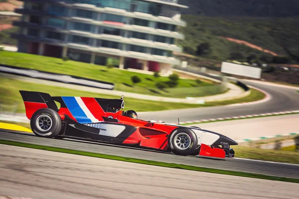 Fast formula car racing on a track — Stock Photo, Image