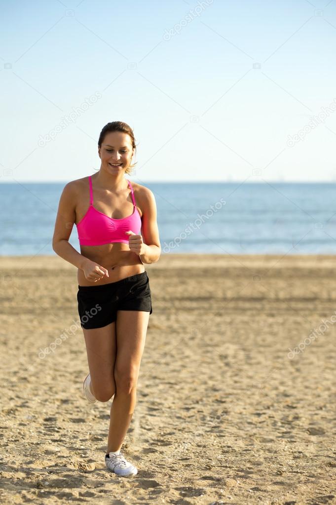 Woman during calisthenics on beach