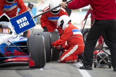 Pit crew during a pitstop clipart