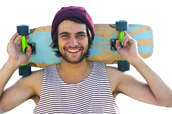 Skateboarder holding  skateboard behind  head. — Stock Photo, Image