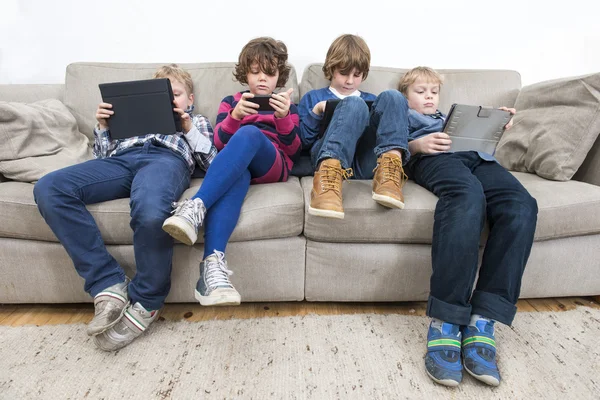 Brothers and sister on sofa — Stock Photo, Image