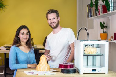 designers standing behind 3D Printing machine clipart