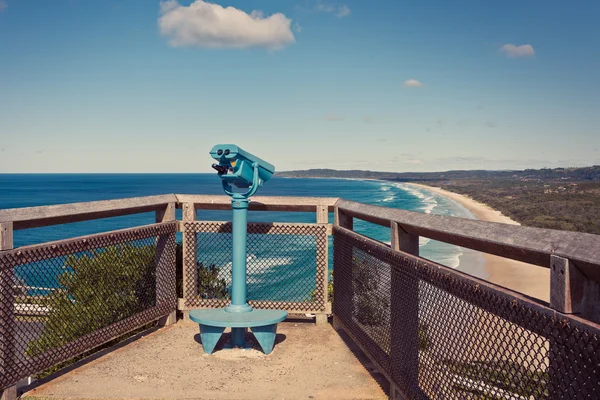 Binoculars overlooking ocean — Stock Photo, Image
