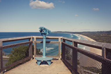 Binoculars overlooking the Gold Coast beaches clipart
