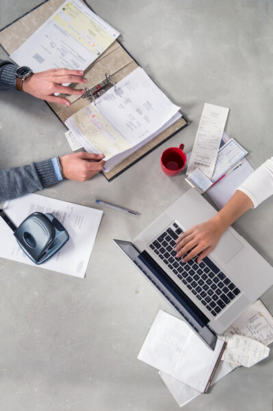 Hands working with paperwork