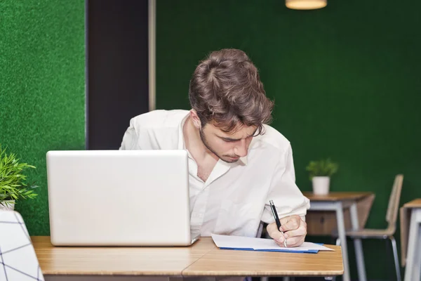 Student cramming for his final exams — Stock Photo, Image