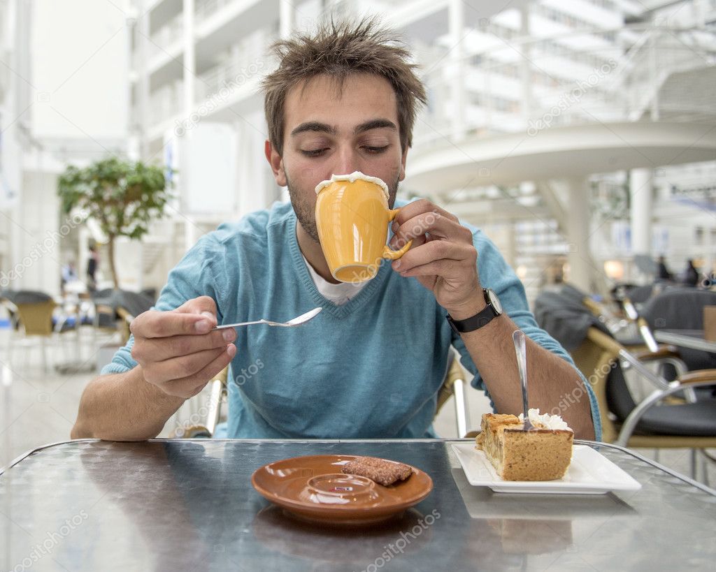 man enjoying hot chocolate